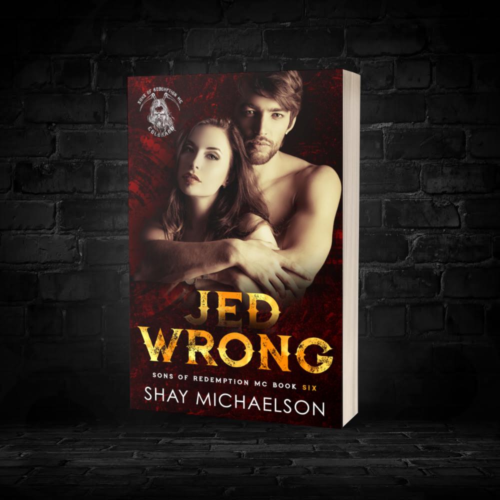 Book cover titled "Jed Wrong" by Shay Michaelson. Features a couple embracing against a dark red background. Tone conveys romance and intensity.